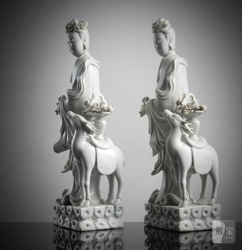 A pair of exquisite Dehua figurines depicting Magu with a deer, standing on a cloud-shaped pedestal with a basket of flowers - 图2